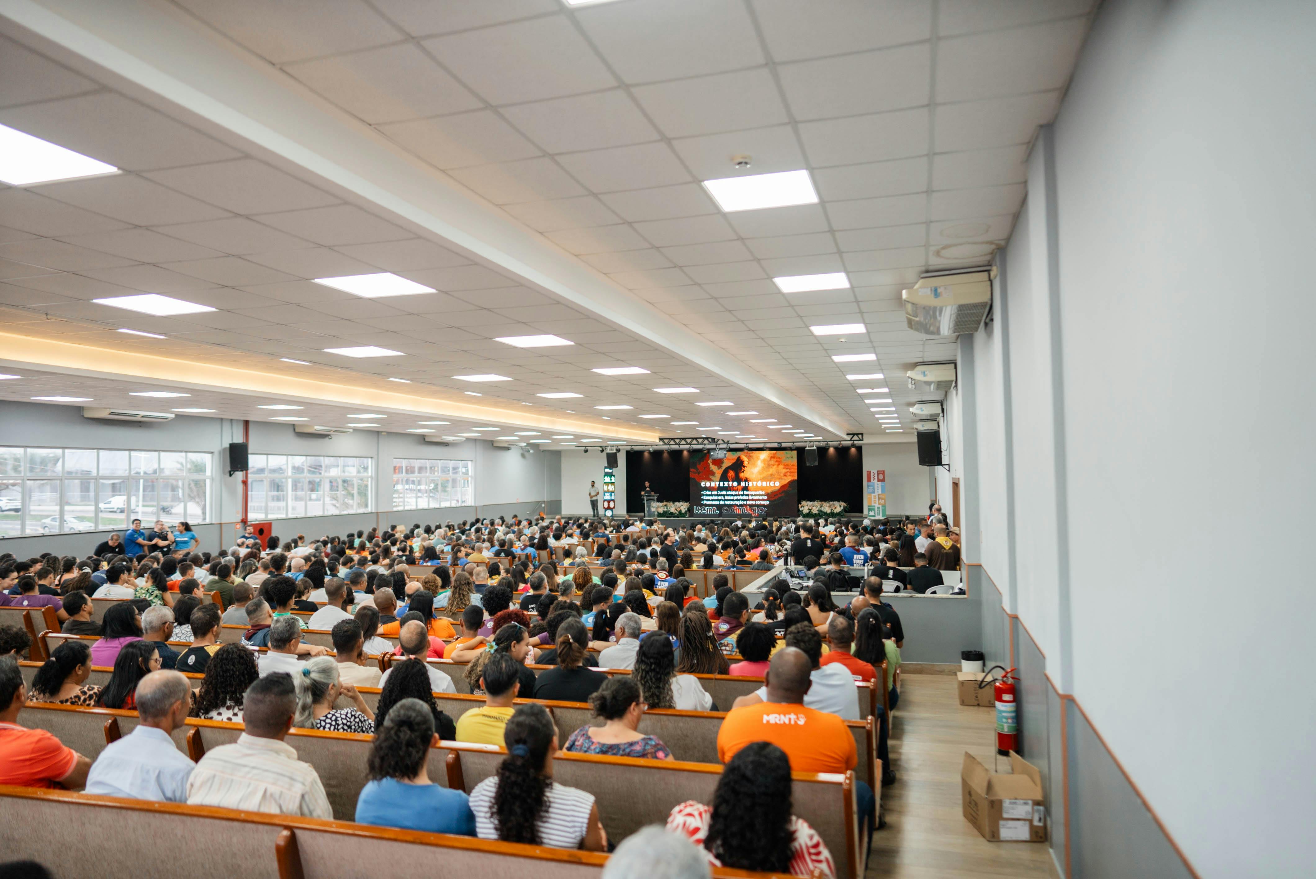 A room full of people connecting at an event